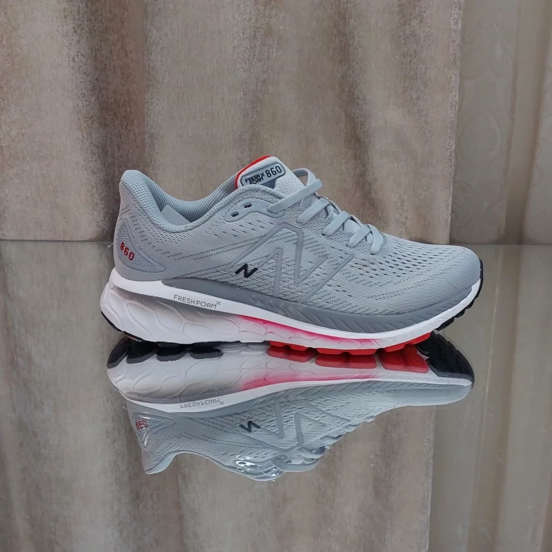 کتونی رانینگ نیوبالانس860  کیفیت مستر کوالیتی ویتنام سایز 41تا45 طوسی کف قرمزnewbalance 860