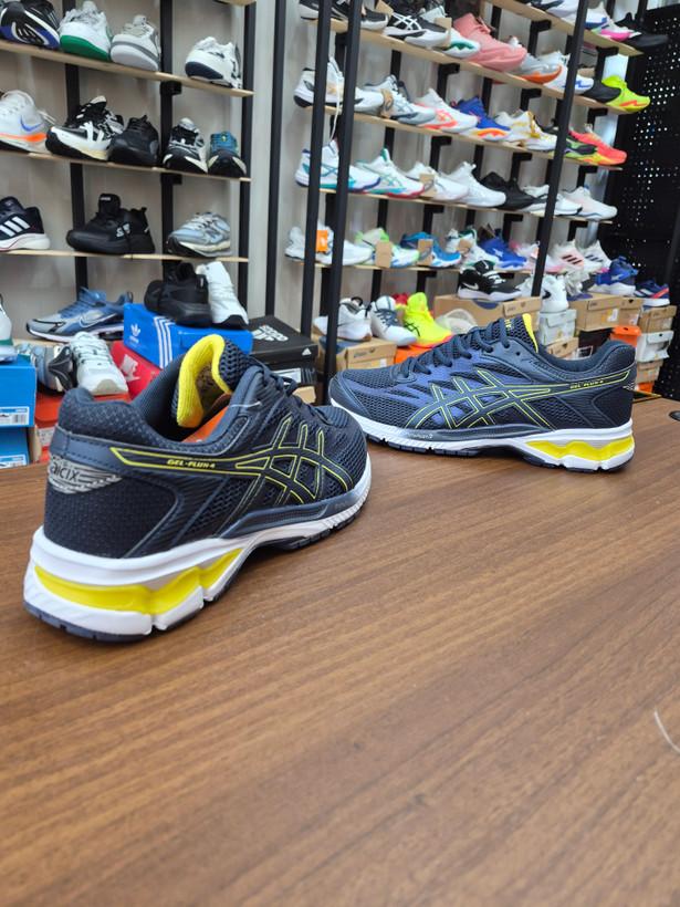 کتونی رانینگ و لایف استایل طرح اسیکس aicix رنگ سورمه ای کف سفید Aicix navy yellow