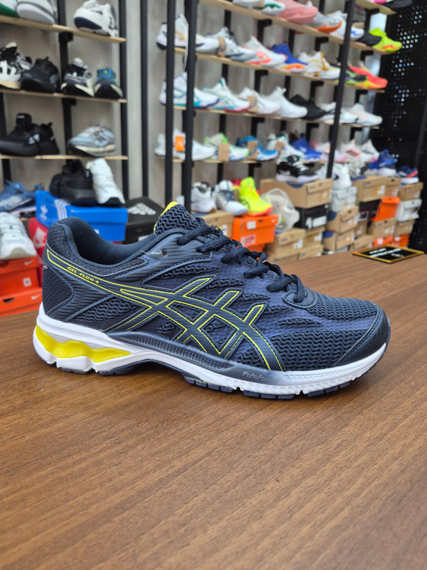 کتونی رانینگ و لایف استایل طرح اسیکس aicix رنگ سورمه ای کف سفید Aicix navy yellow